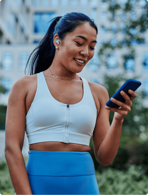Fitness woman using phone